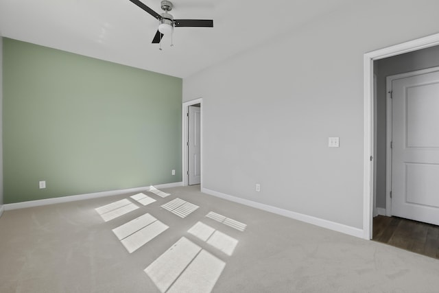 unfurnished bedroom with ceiling fan and carpet floors