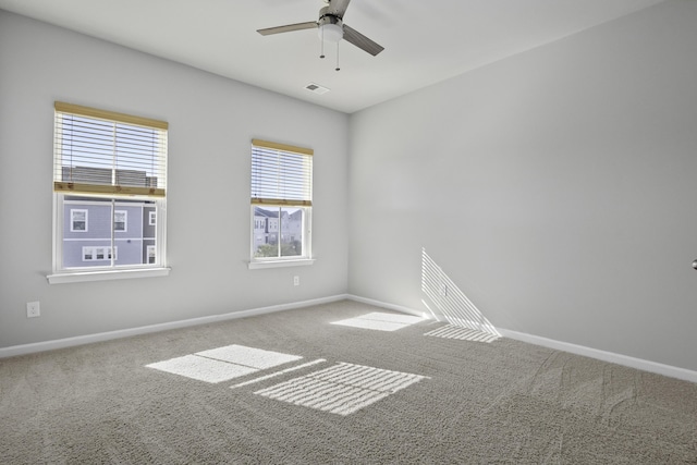 carpeted empty room with ceiling fan