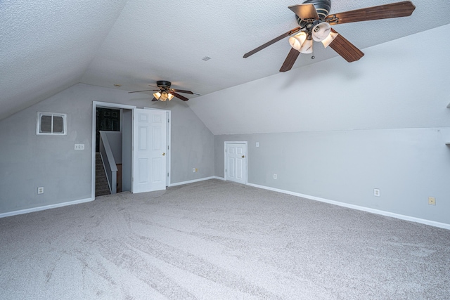 bonus room featuring visible vents, baseboards, a textured ceiling, and ceiling fan