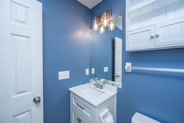 half bath with toilet and vanity