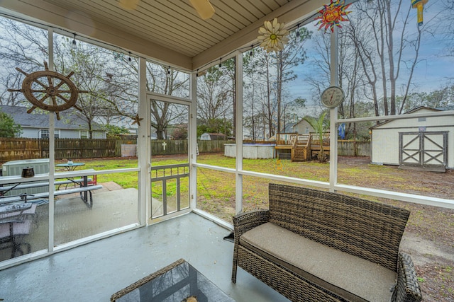 sunroom / solarium with ceiling fan