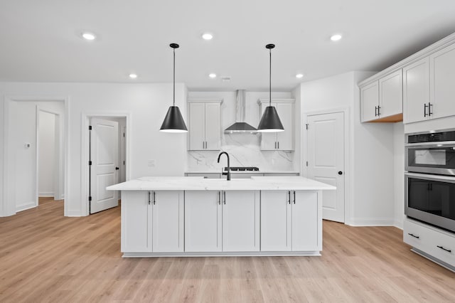 5655 Captain Kidd Rd, Hollywood, SC 29449 - kitchen with stainless steel double oven, wall chimney exhaust hood, baseboards, light wood-type flooring, and tasteful backsplash