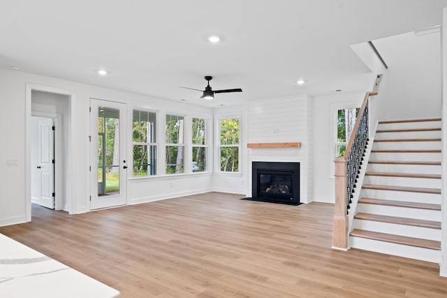 5655 Captain Kidd Rd, Hollywood, SC 29449 - unfurnished living room with ceiling fan, light wood-style floors, a large fireplace, stairs, and recessed lighting
