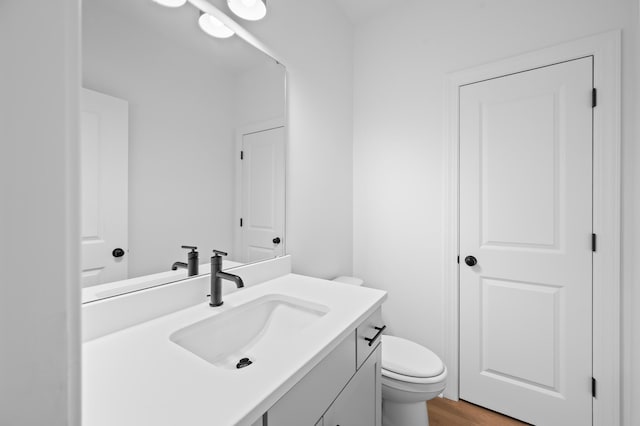 5655 Captain Kidd Rd, Hollywood, SC 29449 - bathroom featuring vanity, toilet, and wood finished floors