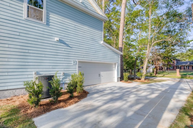 5655 Captain Kidd Rd, Hollywood, SC 29449 - view of side of property featuring central air condition unit, an attached garage, and driveway