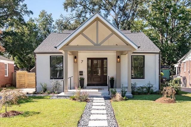 view of front facade featuring a front yard and a porch