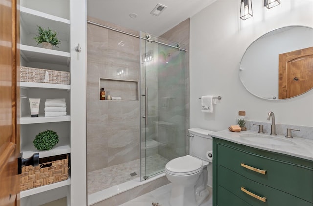 bathroom featuring vanity, toilet, and walk in shower