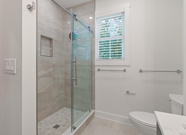 bathroom with vanity, toilet, and walk in shower