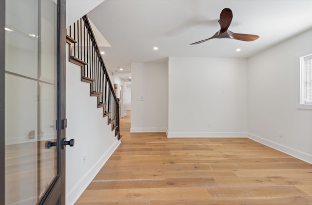 interior space featuring french doors, light wood-type flooring, and ceiling fan