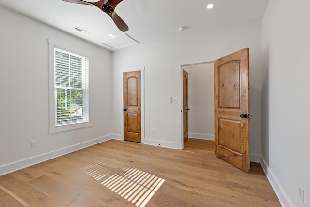 unfurnished bedroom with light hardwood / wood-style floors and ceiling fan