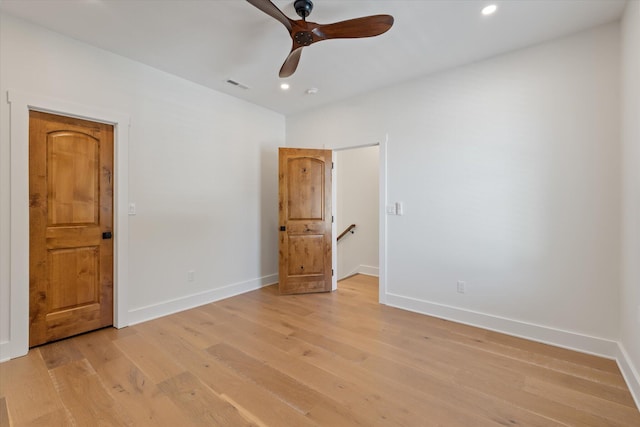 unfurnished bedroom featuring light wood-type flooring and ceiling fan