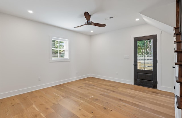 entrance foyer with vaulted ceiling, light hardwood / wood-style flooring, ceiling fan, and plenty of natural light