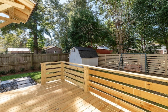 wooden terrace featuring a shed