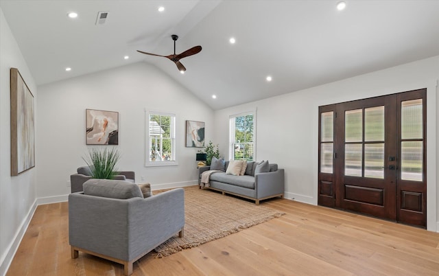 living room with high vaulted ceiling, light wood-type flooring, and ceiling fan