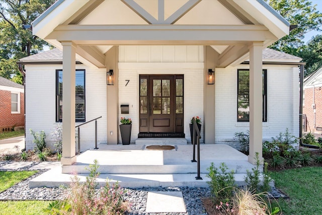 view of exterior entry featuring a porch