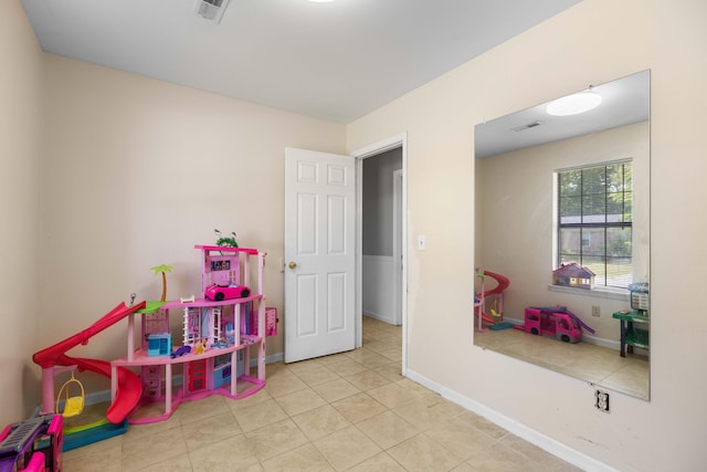 playroom with tile patterned flooring, visible vents, and baseboards