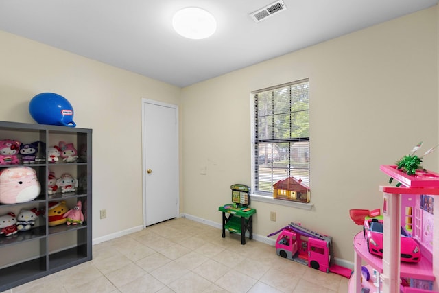 game room featuring tile patterned flooring, visible vents, and baseboards