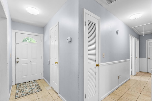 entrance foyer featuring visible vents and light tile patterned floors
