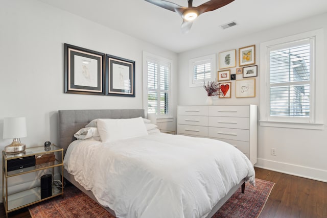 bedroom featuring ceiling fan and dark hardwood / wood-style floors