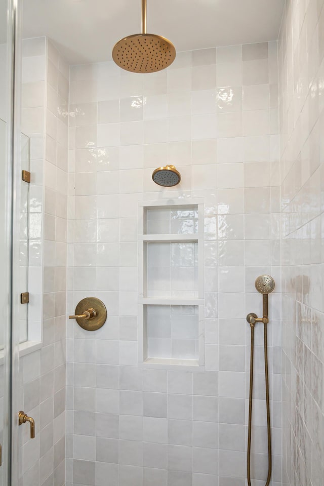 bathroom with tiled shower