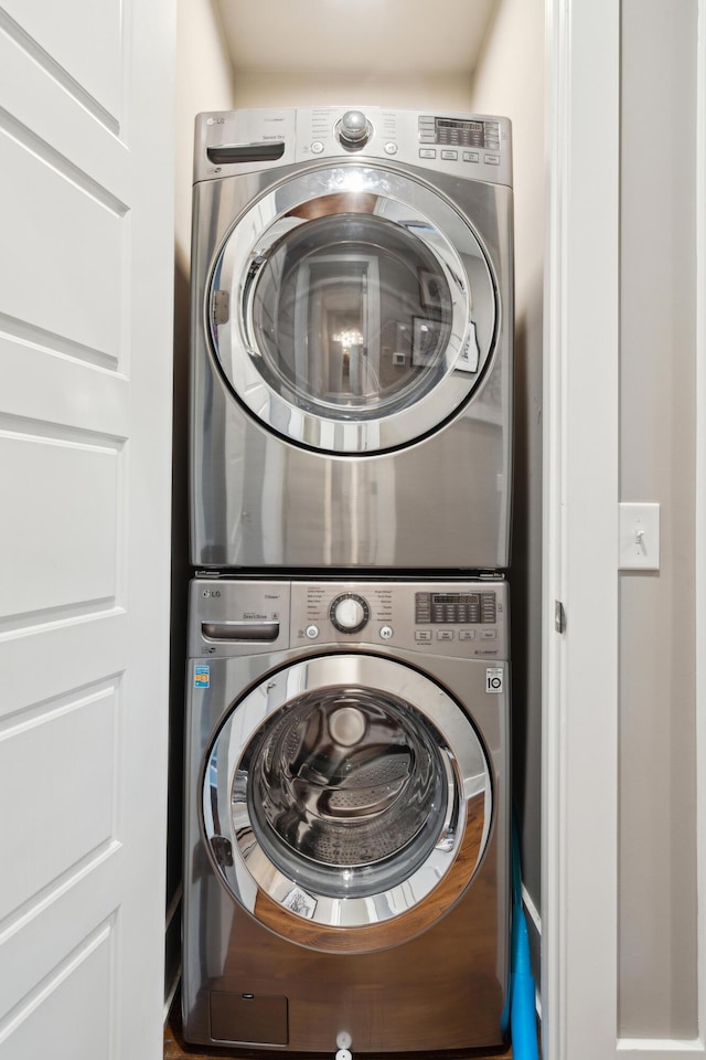 laundry room with stacked washer and clothes dryer