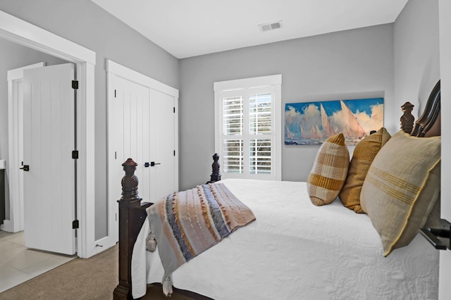 carpeted bedroom with a closet