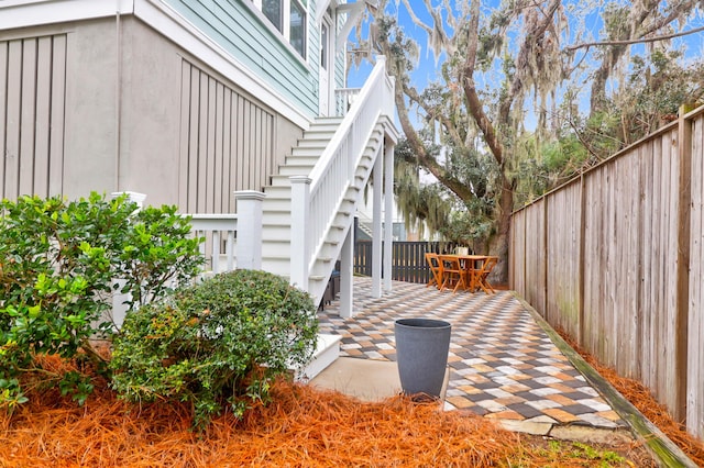 wooden deck with a patio area