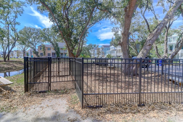 view of gate featuring a water view