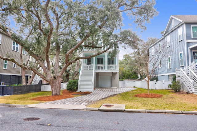 view of front of house with a front lawn and a garage