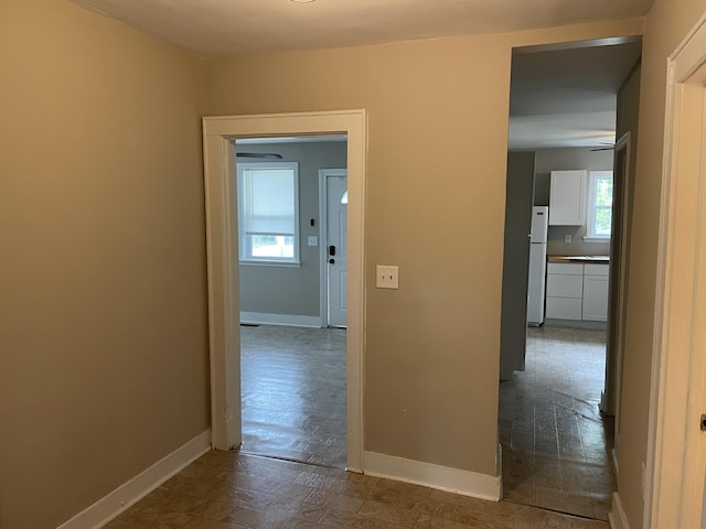 2327 Bailey Dr, North Charleston, SC 29405 - corridor with plenty of natural light and baseboards