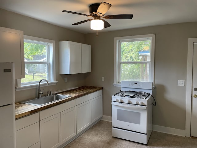 2327 Bailey Dr, North Charleston, SC 29405 - kitchen featuring white appliances, wood counters, a sink, and plenty of natural light