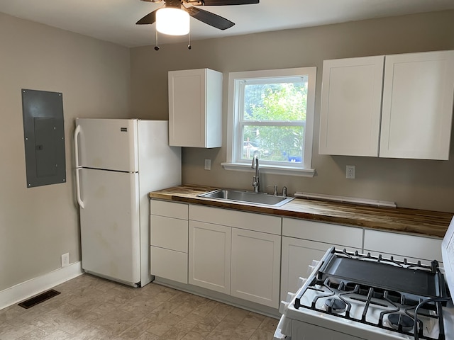 2327 Bailey Dr, North Charleston, SC 29405 - kitchen with electric panel, a sink, wooden counters, white appliances, and a ceiling fan