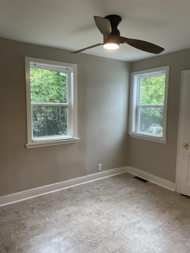 2327 Bailey Dr, North Charleston, SC 29405 - spare room featuring ceiling fan and baseboards