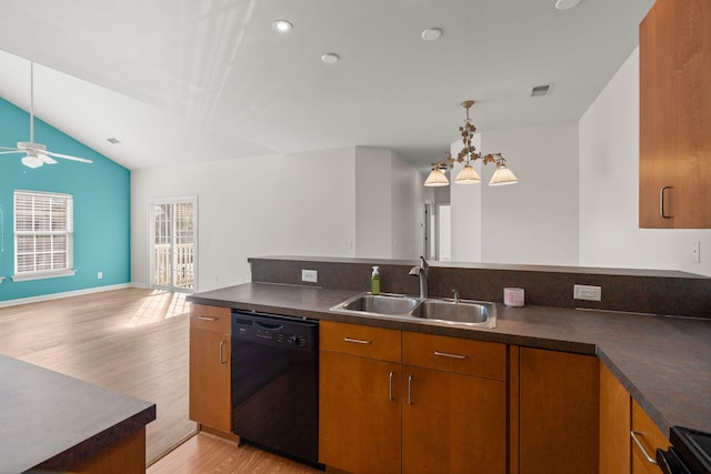 kitchen featuring dishwasher, sink, light hardwood / wood-style floors, vaulted ceiling, and ceiling fan with notable chandelier