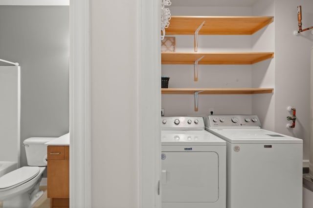 washroom with separate washer and dryer