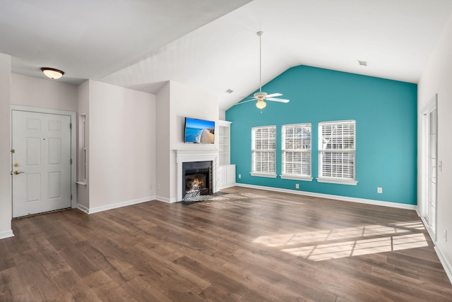 unfurnished living room featuring ceiling fan, lofted ceiling, and dark wood-type flooring