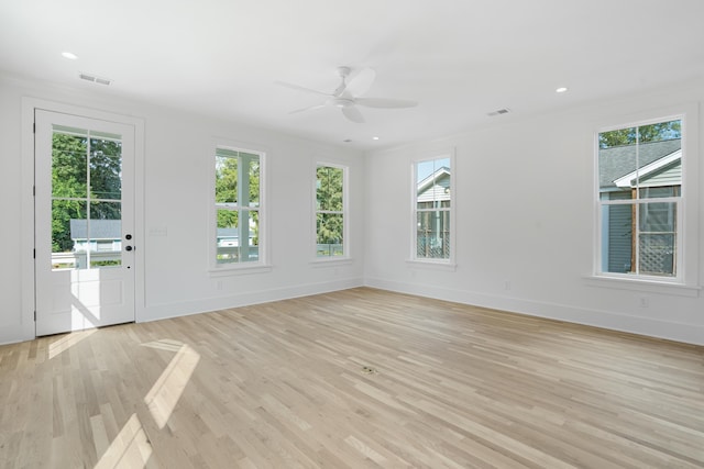 unfurnished room featuring light hardwood / wood-style floors and ceiling fan