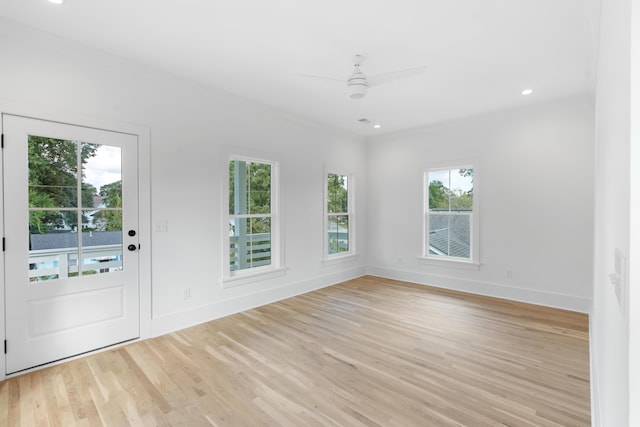 entryway featuring ceiling fan, ornamental molding, and light hardwood / wood-style flooring