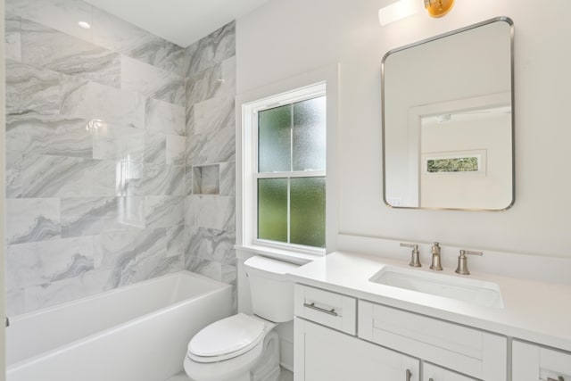 full bathroom featuring vanity, shower / bath combination, and toilet