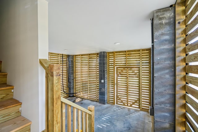 stairway with concrete floors