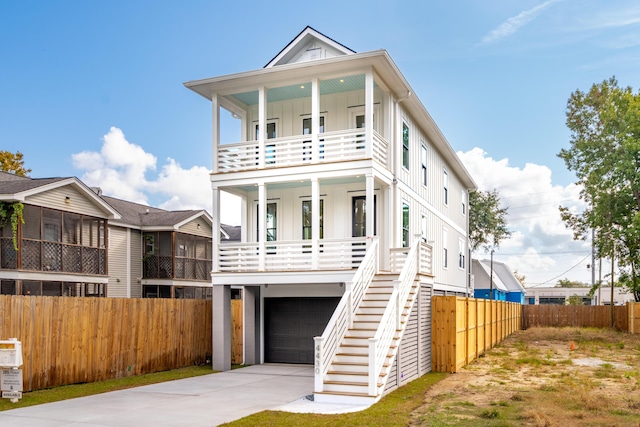 view of front of property with a porch and a garage