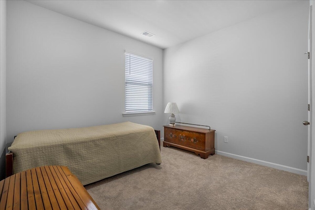 bedroom featuring light colored carpet