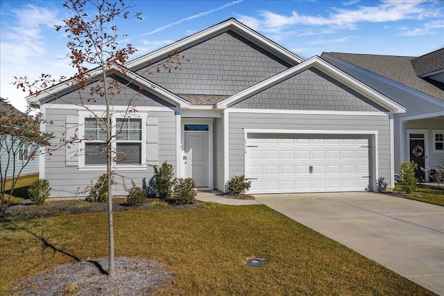 view of front facade with a garage and a front lawn