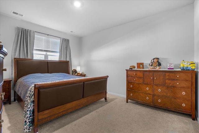 bedroom featuring light colored carpet