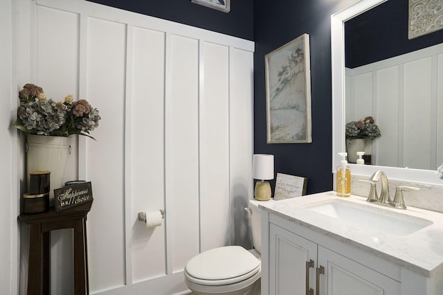 bathroom with vanity and toilet