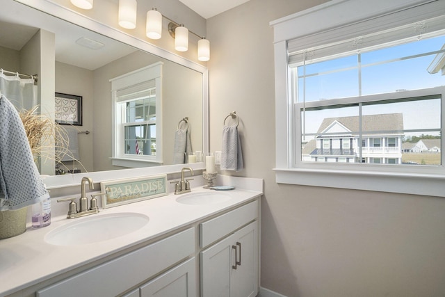 bathroom featuring double vanity and a sink