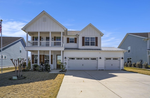 view of front of home featuring a balcony, board and batten siding, concrete driveway, and a standing seam roof