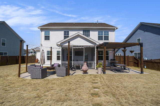 back of house featuring a patio area, a lawn, a fenced backyard, and an outdoor hangout area