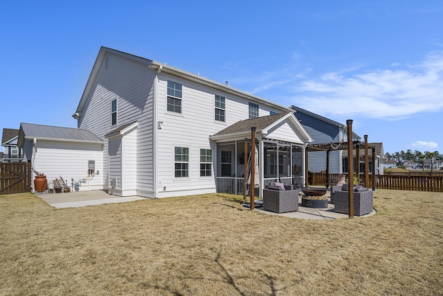 rear view of house featuring a patio, a yard, fence, and a sunroom