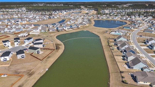 aerial view featuring a residential view and a water view